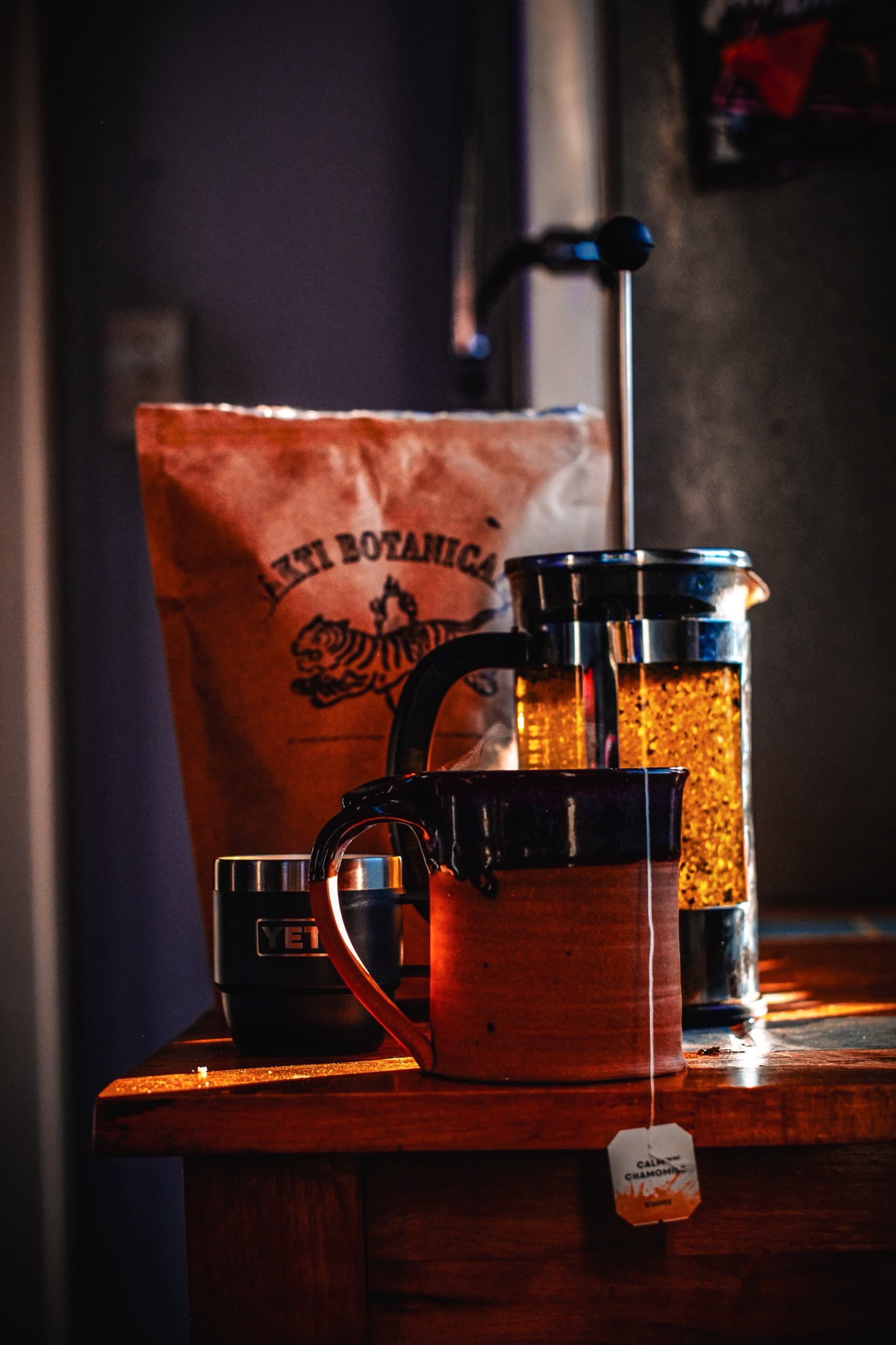 Sakti kraft bag, French press, and mug set out for crushed leaf tea